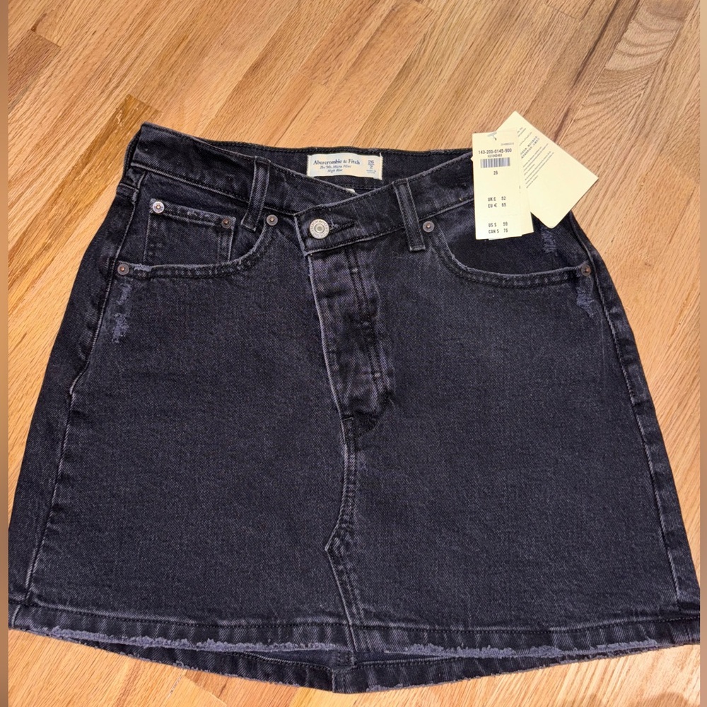 Asymmetrical black denim skirt